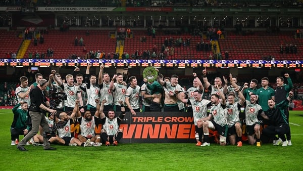 22 February 2025; Ireland captain Dan Sheehan lifts the Triple Crown trophy alongside team-mates after the Guinness Six Nations Rugby Championship match between Wales and Ireland at the Principality Stadium in Cardiff, Wales. Photo by Seb Daly/Sportsfile