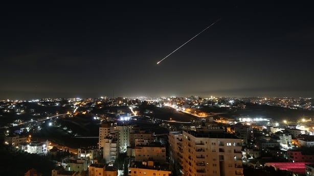 HEBRON, WEST BANK - MARCH 12: Missiles launched from Iran in retaliation for Israeli attacks are seen in the night sky over the city of Hebron in the West Bank on March 12, 2026. (Photo by Wisam Hashlamoun/Anadolu via Getty Images)