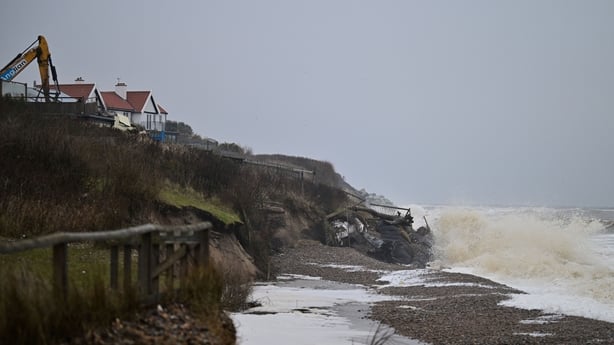 This photo taken on February 3, 2026 shows a general view of the demolition of a property on the coastline of Thorpeness, Suffolk. In an English seaside village, researchers discuss options for relocating a graveyard threatened with slipping into the sea, or moving back a car park perilously close t