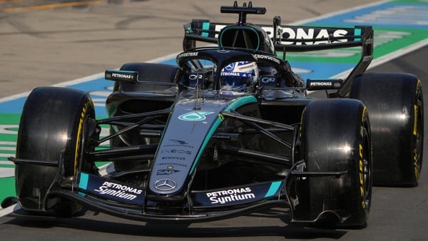 Mercedes' British driver George Russell drives in the pit lane during the sprint qualifying session ahead of the Formula One Chinese Grand Prix at the Shanghai International Circuit in Shanghai on March 13, 2026.
