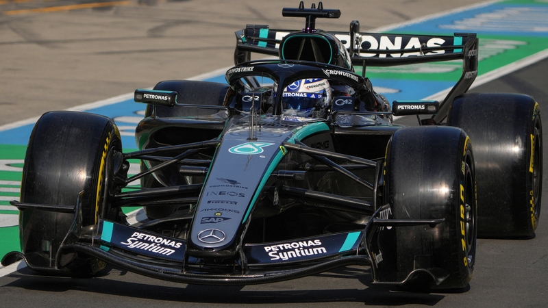 Mercedes' British driver George Russell drives in the pit lane during the sprint qualifying session ahead of the Formula One Chinese Grand Prix at the Shanghai International Circuit in Shanghai on March 13, 2026.