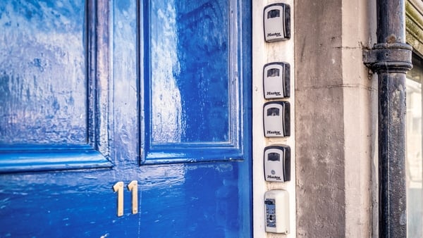 A series of security boxes for keys outside the entrance door to flats, used for AirBnB and other short term rentals.