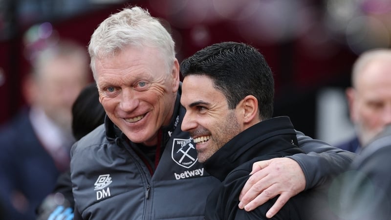 West Ham United's Scottish manager David Moyes (L) shares a joke with Arsenal's Spanish manager Mikel Arteta (R) ahead of kick-off in the English Premier League football match between West Ham United and Arsenal at the London Stadium, in London on Februar