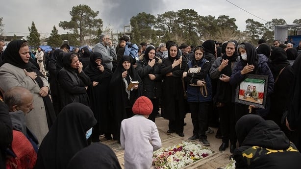 People mourn as they attend the funeral ceremony of those who were killed in the US-Israeli attacks on Iran