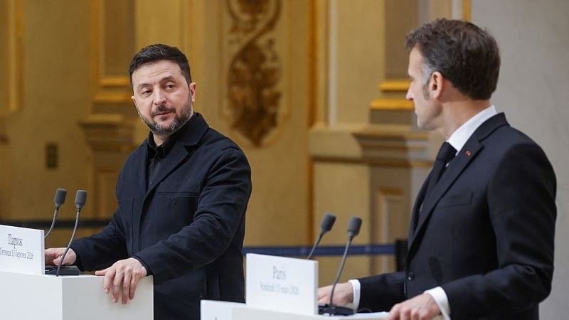 Ukraine's President Volodymyr Zelensky (L) and France's President Emmanuel Macron (R) deliver a speech during a joint press conference