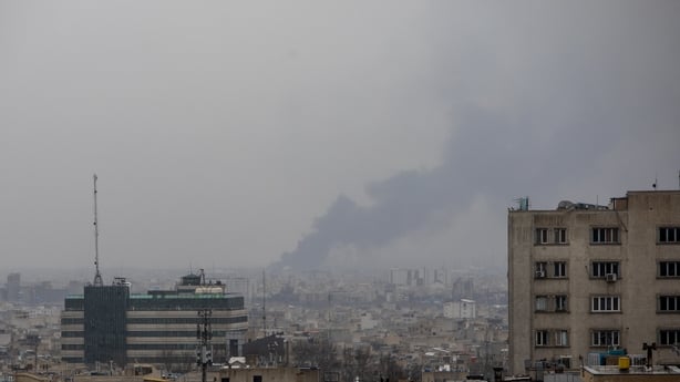 TEHRAN, IRAN - MARCH 13: Smoke rises in the distance following an airstrike at the same time a Quds Day demonstration takes place on March 13, 2026 in Tehran, Iran. International Quds Day (which takes its name from the Arabic name for Jerusalem) is an annual pro-Palestinian event created in Iran in 