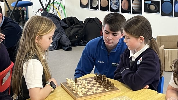 James Knoblauch with Ella and Olivia at chess club