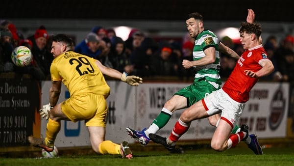 13 March 2026; Aaron Greene of Shamrock Rovers has a shot on goal despite the attention of Sligo Rovers goalkeeper Sam Sargeant, left, and Gareth McElroy of Sligo Rovers during the SSE Airtricity Men's Premier Division match between Sligo Rovers and Shamr