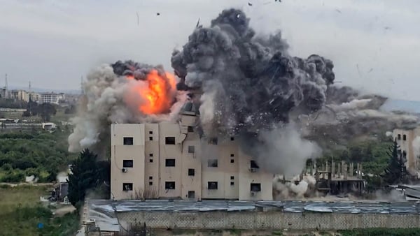 A fireball errupts from the site of an Israeli airstrike that targeted a building in the southern Lebanese village of Abbasiyyeh