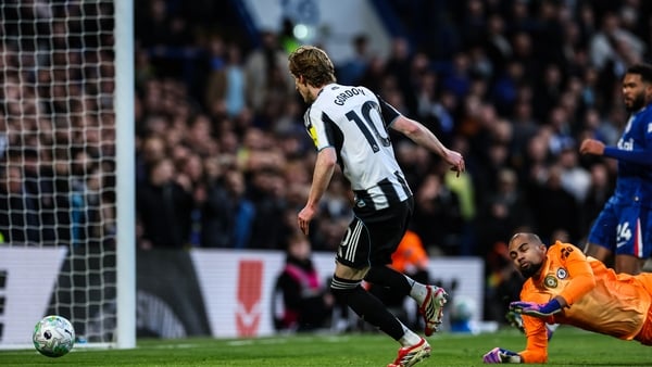 LONDON, ENGLAND - MARCH 14: Newcastle United's Anthony Gordon scoring his side's first goal during the Premier League match between Chelsea and Newcastle United at Stamford Bridge on March 14, 2026 in London, England. (Photo by Andrew Kearns - CameraSport