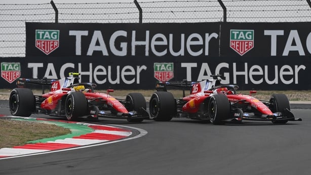 SHANGHAI, CHINA - MARCH 15: Charles Leclerc of Monaco driving the (16) Scuderia Ferrari SF-26 and Lewis Hamilton of Great Britain driving the (44) Scuderia Ferrari SF-26 battle for track position during the F1 Grand Prix of China at Shanghai International Circuit on March 15, 2026 in Shanghai, China