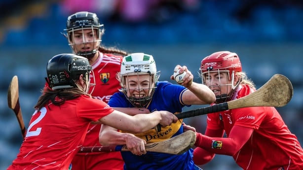Clodagh McIntyre of Tipperary in action against Meabh Murphy, Ava Fitzgerald, and Libby Coppinger of Cork