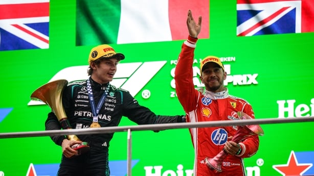 Race winner Andrea Kimi Antonelli of Italy and Mercedes AMG Petronas F1 Team and Third placed Lewis Hamilton of Great Britain and Scuderia Ferrari on the podium during the F1 Grand Prix of China at Shanghai International Circuit on March 15, 2026 in Shanghai, China.