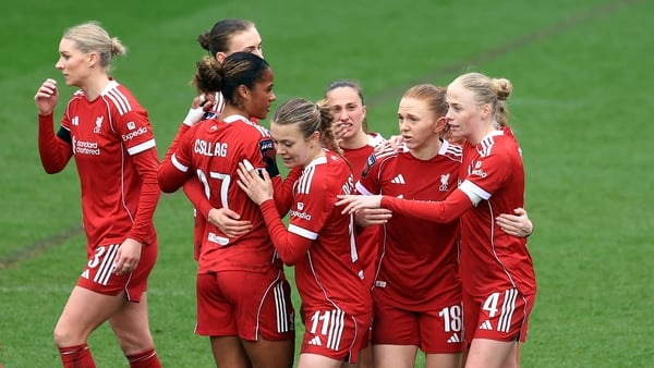 Ceri Holland of Liverpool (2R) celebrates scoring her team's second goal with teammates during the Barclays Women's Super League match between Liverpool and Leicester City at The St Helens Stadium on March 15, 2026 in St Helens, England.