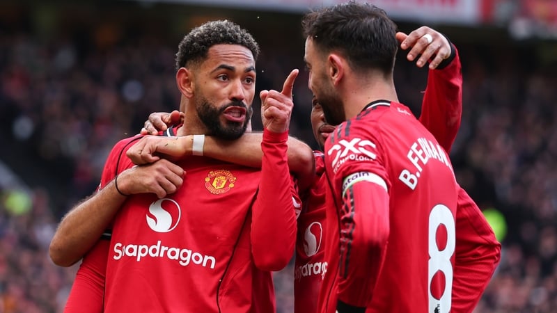 Matheus Cunha of Manchester United celebrates scoring their second goal with Bruno Fernandes during the Premier League match between Manchester United and Aston Villa at Old Trafford on March 15, 2026 in Manchester, England.