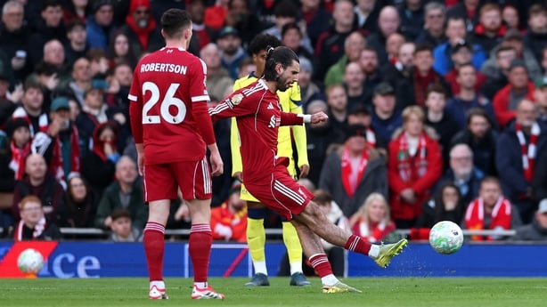 Dominik Szoboszlai of Liverpool scores his team's first goal during the Premier League match between Liverpool and Tottenham Hotspur at Anfield on March 15, 2026 in Liverpool