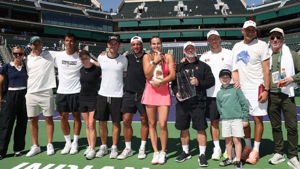 Aryna Sabalenka poses with her team and new dog, Ash, after defeating Elena Rybakina of Kazakhstan to win the championship during their Women's Singles Finals match on Day 12 of the BNP Paribas Open at Indian Wells Tennis Garden on March 15, 2026 in India