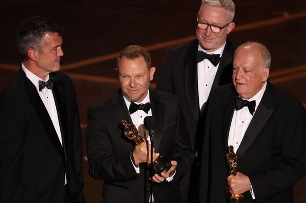 (L-R) Eric Saindon, Richard Baneham, Daniel Barrett and Joe Letteri accept the award for Best Visual Effects for Avatar: Fire and Ash onstage during the 98th Annual Academy Awards at the Dolby Theatre in Hollywood, California on 15 March, 2026. (Photo by Patrick T. Fallon / AFP)