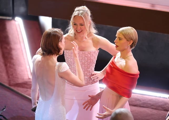 HOLLYWOOD, CALIFORNIA - MARCH 15: (L-R) Emma Stone, Lynette Howell Taylor, President, Academy of Motion Picture Arts and Sciences, and Jessie Buckley attend the 98th Oscars at Dolby Theatre on March 15, 2026 in Hollywood, California. (Photo by Kevin Winte