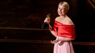 Jessie Buckley accepts the Actress in a Leading Role award for "Hamnet" onstage during the 98th Oscars