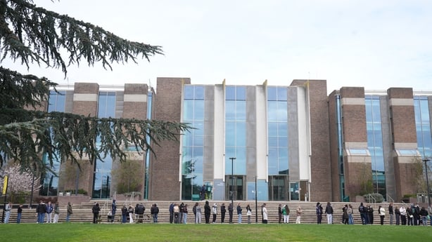 Students queuing for antibiotics outside a building at the University of Kent in Canterbury