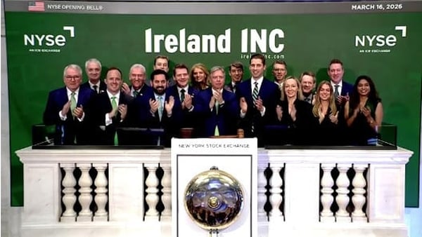 A large group of people in front of a green backround saying Ireland INC and NYSE New York Stock Exchange on March 16th, 2026