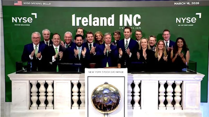 A large group of people in front of a green backround saying Ireland INC and NYSE New York Stock Exchange on March 16th, 2026