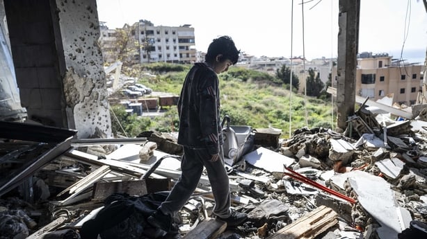 BEIRUT, LEBANON - MARCH 16: 12-year-old boy Ahmed stands among debris after airstrike carried out by the Israeli military on the town of Sharhabil left one person dead and three others injured in Beirut, Lebanon on March 16, 2026. Ahmed, who was living on the upper floor at the time of the attack, i