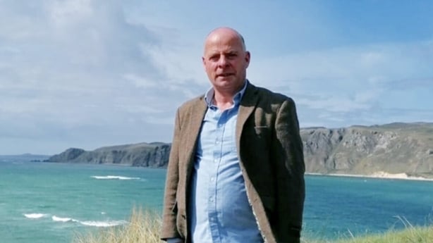 Pat Doherty of Doagh Famine Village looks to camera