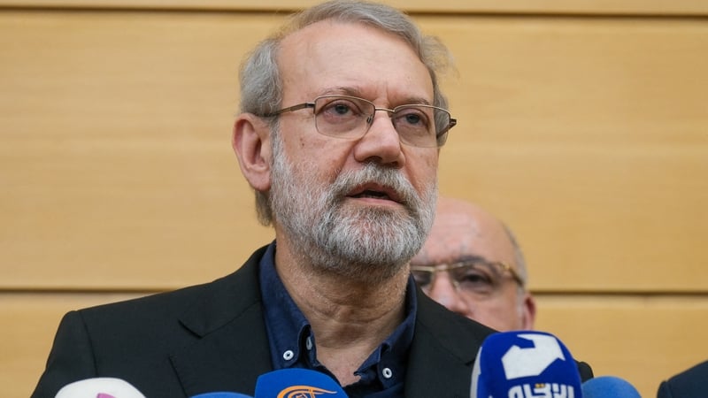 A photograph of Ali Larijani, wearing glasses and with grey hair and a grey beard