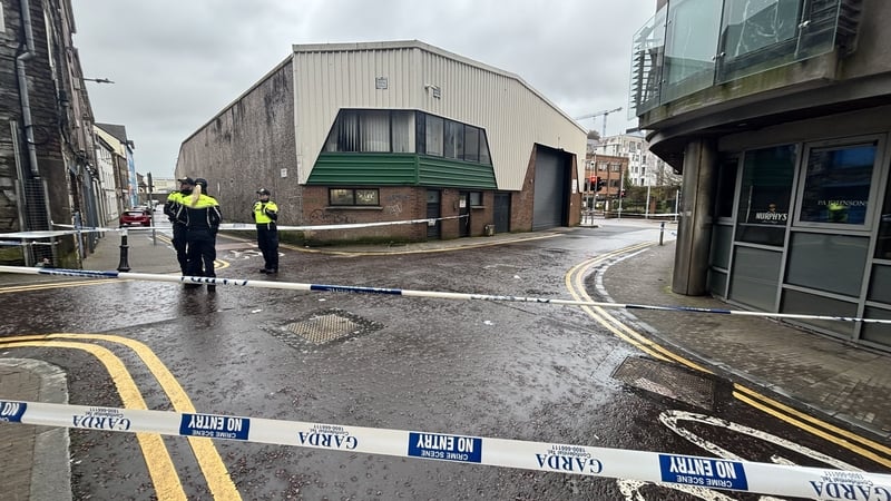 Gardai are pictured at a cordoned off area following a stabbing in Cork city centre