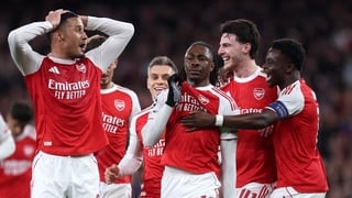 Eberechi Eze of Arsenal celebrates scoring his team's first goal with teammates during the UEFA Champions League 2025/26 Round of 16 Second Leg match between Arsenal FC and Bayer 04 Leverkusen at Arsenal Stadium on March 17, 2026 in London, England.