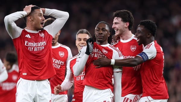 Eberechi Eze of Arsenal celebrates scoring his team's first goal with teammates during the UEFA Champions League 2025/26 Round of 16 Second Leg match between Arsenal FC and Bayer 04 Leverkusen at Arsenal Stadium on March 17, 2026 in London, England.