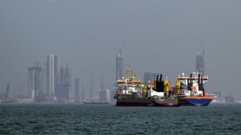 Commercial vessels are pictured offshore in Dubai on March 11, 2026. New attacks hit three commercial ships in the Gulf on March 11, with one of the vessels in flames as Iran pressed its campaign against its oil-exporting neighbours, threatening shipping