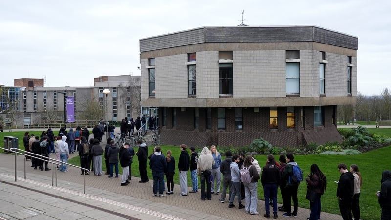 Students queuing for antibiotics outside a building at the University of Kent in Canterbury