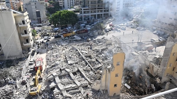 An aerial view of a flattened multi-story building
