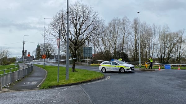 A garda car and garda cordon tape pictured on a street called Athlunkard Street in Limerick city