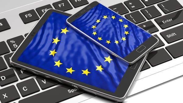 stock image of electronic devices with eu flag on the screens
