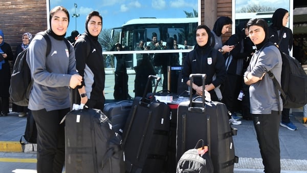 Members of Iran's women's football team stand at Igdir airport