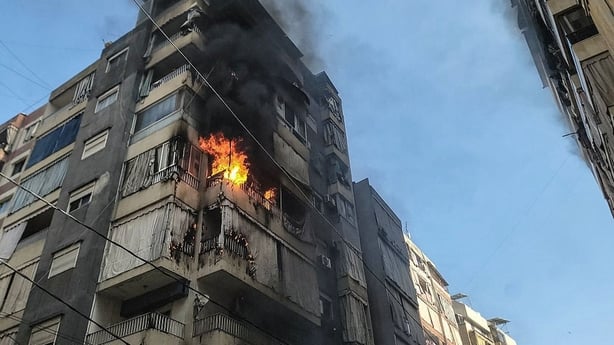 Flames rise from an apartment targeted by an Israeli airstrike in central Beirut's Zuqaq al-Blat neighbourhood