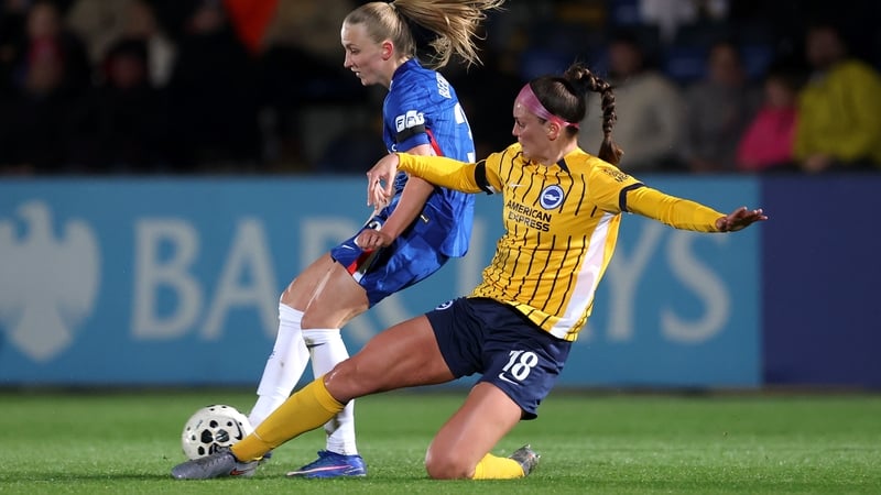 KINGSTON UPON THAMES, ENGLAND - MARCH 18: Aggie Beever-Jones of Chelsea is challenged by Caitlyn Hayes of Brighton & Hove Albion during the Barclays Women's Super League match between Chelsea FC and Brighton & Hove Albion at Kingsmeadow on March 18, 2026