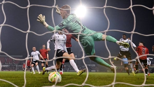 A header from Bohemians' Patrick Hickey gets the better of Dundalk keeper Enda Minogue to open the scoring at Dalymount Park