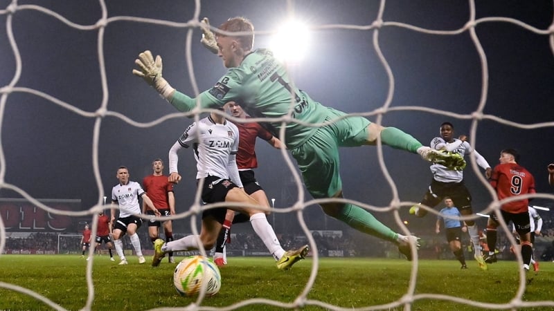 A header from Bohemians' Patrick Hickey gets the better of Dundalk keeper Enda Minogue to open the scoring at Dalymount Park