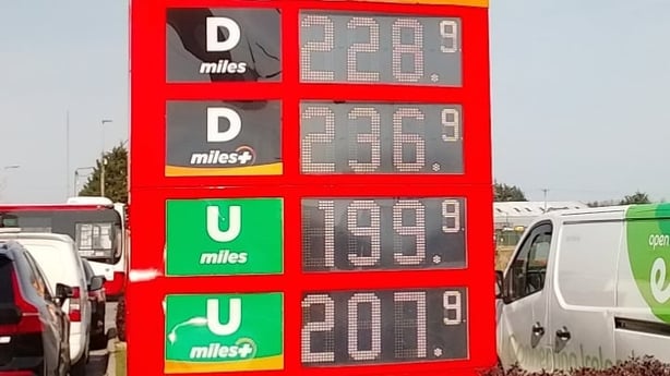 an electronic sign displaying the prices of diesel and petrol