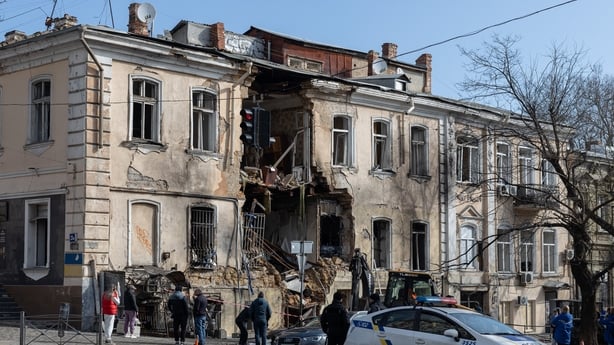 ODESA, UKRAINE - MARCH 19: Municipal workers clear the aftermath of a Russian airstrike on a multi-story building on March 19, 2026 in Odesa, Ukraine. Russian forces launched a mass drone attack on the city overnight on March 19. Twelve residential buildings and a university dormitory were damaged. 