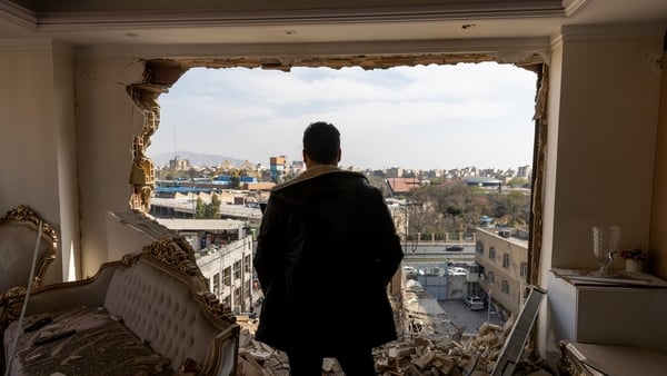 TEHRAN, IRAN - MARCH 14: A man stands in a damaged residence on March 14, 2026 at the site of buildings, including a police station, that were destroyed in an airstrike two days ago in the Khani Abad neighbourhood of Tehran, Iran. According to authorities