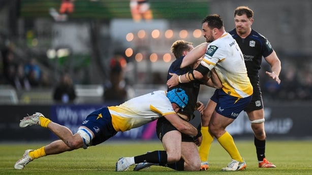 21 March 2026; Stafford McDowall of Glasgow Warriors is tackled by Will Connors, left, and Rónan Kelleher of Leinster, resulting in a yellow card for Kelleher, during the United Rugby Championship match between Glasgow Warriors and Leinster at Scotstoun Stadium in Glasgow, Scotland. Photo by Brendan