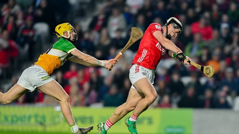 21 March 2026; Barry Walsh of Cork shoots to score his side's first goal despite the efforts of Daniel Bourke of Offaly during the Allianz Hurling League Division 1A match between Cork and Offaly at SuperValu Páirc Ui Chaoimh in Cork. Photo by Tyler Mille