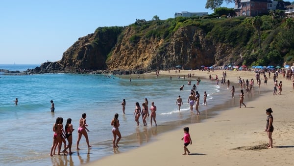 LAGUNA BEACH, CALIFORNIA - MARCH 20: People gather along the coast at Crescent Bay Beach on the first day of spring during a record-setting heat wave on March 20, 2026 in Laguna Beach, California. (Photo by Kevin Carter/Getty Images)