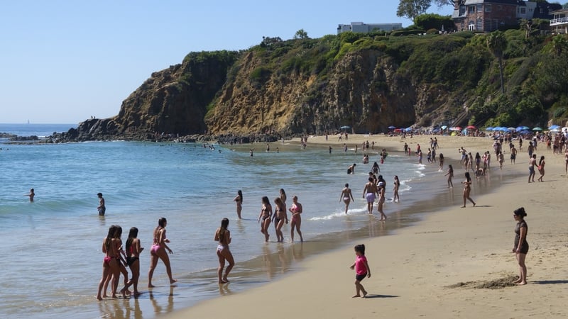 LAGUNA BEACH, CALIFORNIA - MARCH 20: People gather along the coast at Crescent Bay Beach on the first day of spring during a record-setting heat wave on March 20, 2026 in Laguna Beach, California. (Photo by Kevin Carter/Getty Images)